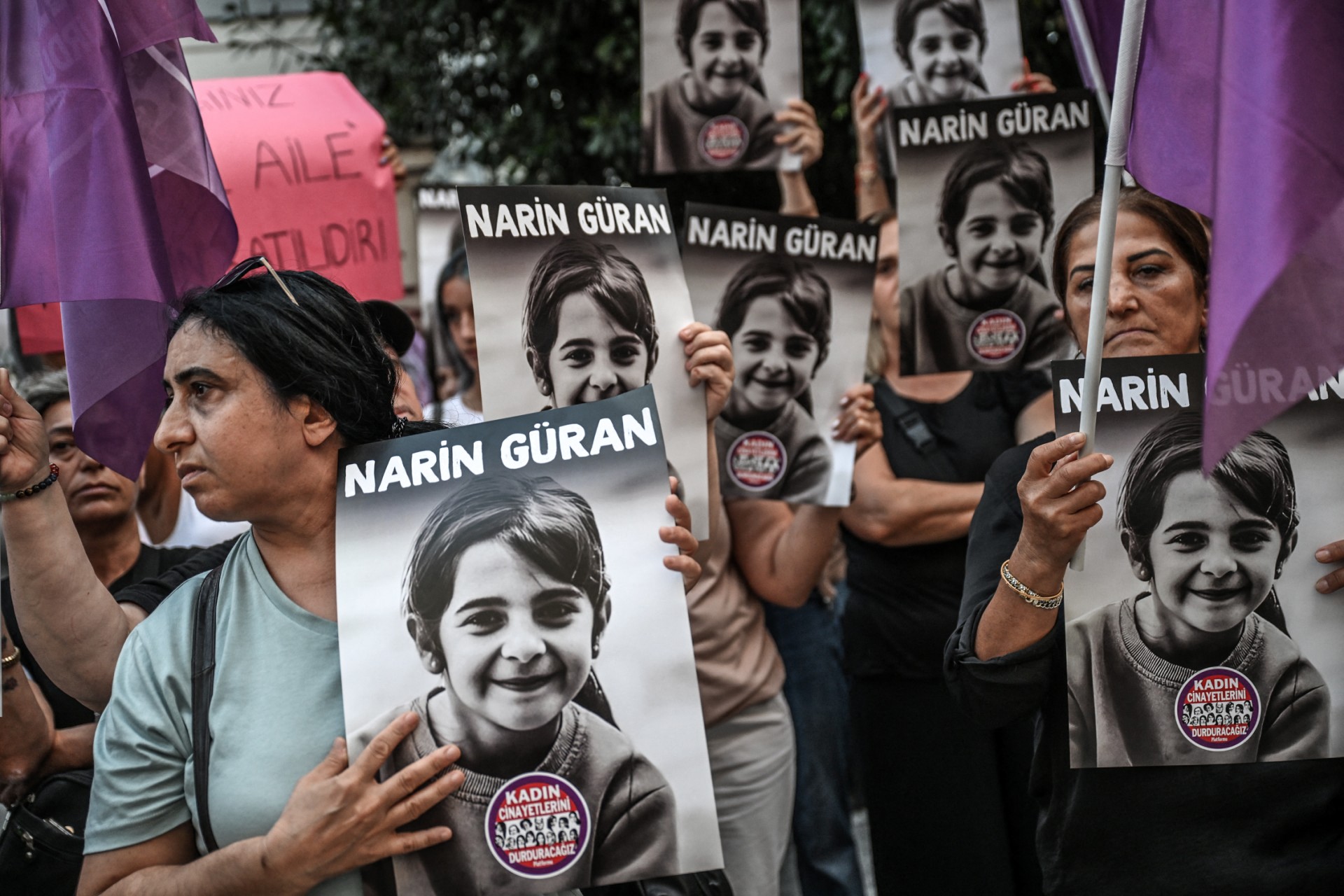 Protesters hold portraits of eight-year-old Narin Güran, during a protest at Kadıköy district in Istanbul, on September 8, 2024. (Photo by Ozan KOSE / AFP)